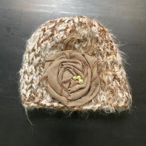Hand knitted beanie with floral and feathers